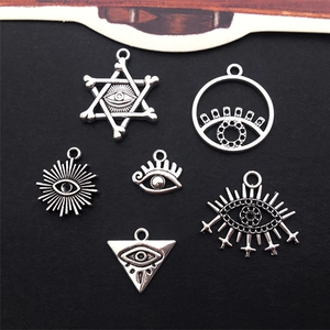 Detail showing six diverse silver alloy Eye of Horus charms for DIY jewelry making