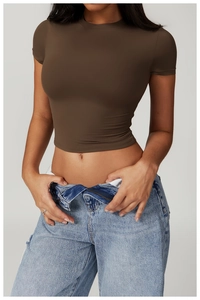 Detail of slim fit brown quick-dry sports t-shirt with soft stretch fabric for yoga