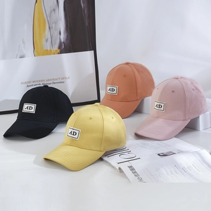 Detail view of multi-color cotton baseball caps with AD embroidery in stylish colors