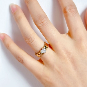 Elegant gold heart zircon ring with twisted rope band texture on model finger