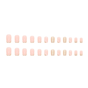 Faux ongles français rose et doré pailleté avec motif floral blanc forme amande longue