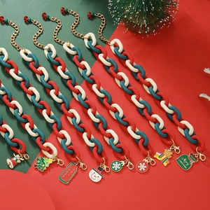 Detail of Christmas acrylic bracelets with snowman, snowflake and tree charms