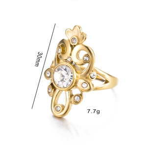 Detailed close-up of golden vintage openwork ring with 30mm length and zircon stone