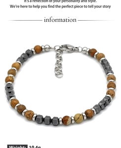 Detail of beaded men's bracelet with brown agate and hematite beads featuring lobster clasp