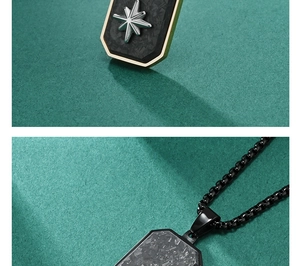 Macro shot of carbon fiber texture with golden hexagram star on a black dog tag pendant