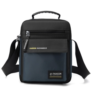 Vertical nylon crossbody bag for men in navy blue and black with top handle and strap
