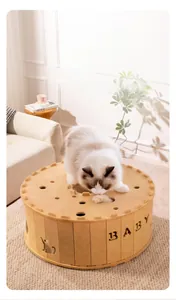 Detail of felt cat tunnel toy with circular cutouts and decorative cat silhouette carving