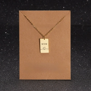 Gold Mama necklace with rectangular pendant on gift card for Mother's Day gifts