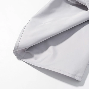Detail view of the light grey suit trousers hem with professional double stitching
