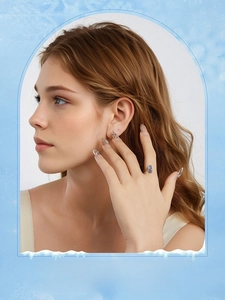 Model wearing a blue flower ring and matching earrings in S925 sterling silver