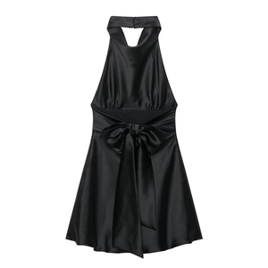 Elegant black satin halter neck dress featuring a large bow detail on a white background