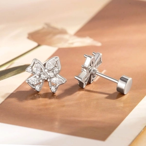 Bowknot surgical steel stud earrings with shimmering zircons shown from both front and back