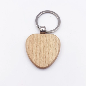 DIY heart-shaped beech wood keychain with metal ring on plain white background
