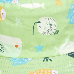 Detail of cartoon sea creature print and fine stitching on light green bucket hat