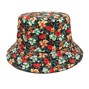 Close-up of vibrant floral pattern on bucket hat with detailed canvas fabric texture
