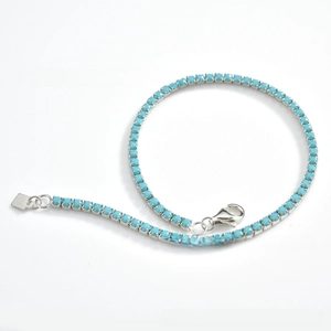 Detailed view of turquoise tennis chain with lobster clasp and square logo tag