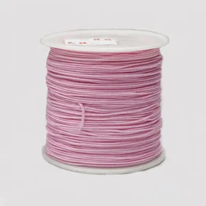 Detail of 0.8mm pink nylon cord spool for DIY jewelry making and braided bracelets