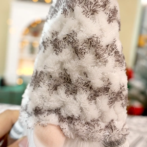 Christmas plush gnome decoration with grey and white pointed hat for festive window display