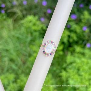 Detailed macro view of 18K gold-plated Virgin Mary ring with colorful zircon stones