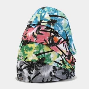 Vintage short-brimmed caps with tropical palm tree prints in four gradient color schemes