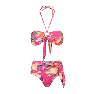 Detail of rose pink floral bikini featuring tropical print and amber ring ornaments