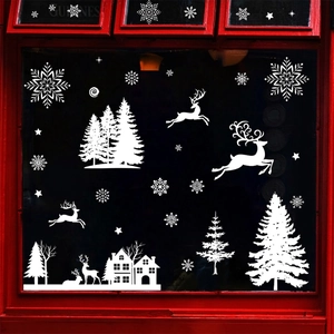 White Christmas window stickers featuring snowflakes, reindeers, trees and houses