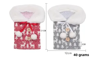 Detailed view of knitted Christmas wine bottle covers with reindeer patterns and faux fur
