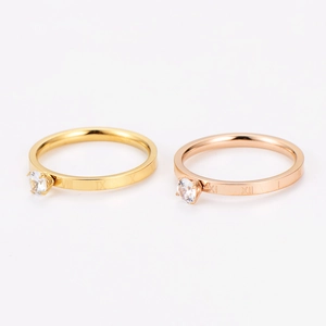 Set of gold and rose gold Roman numeral rings with sparkling zircon inlay for women