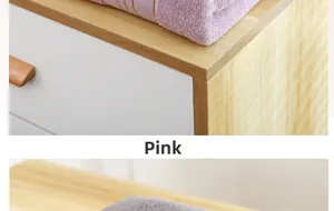 Close-up of pink and grey thick cotton bath towels with soft absorbent looped texture