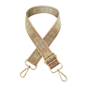Detail of 3.8cm wide jacquard strap with floral embroidery and golden swivel hooks