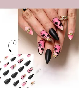 Close-up of sunset gradient press-on nails with palm tree silhouettes and shells