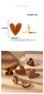 Detail view of heart-shaped earrings with 2.25cm x 2.01cm size specifications