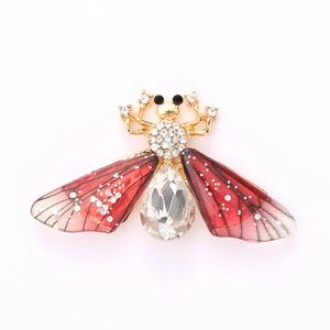 Exquisite gold bee brooch with red crystal wings and sparkling rhinestone accents