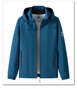 Detailed view of dark blue hooded jacket featuring side zip pockets and elastic cuffs
