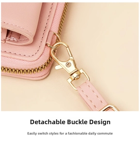 Detailed close-up of pink leather phone bag showing golden lobster clasp and stitching