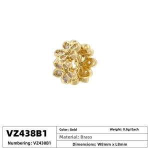 Macro shot of 8mm gold hollow flower spacer bead with sparkling zircon in brass