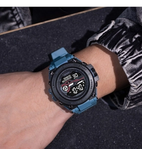 Close-up of blue digital sport watch with multi-function display on model wrist