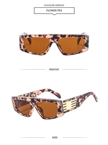 Detail view of tortoiseshell sunglasses with brown lenses and metallic temple accents