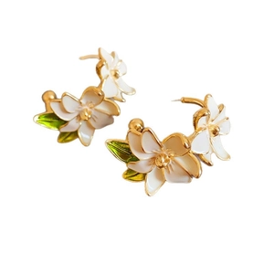 Elegant white magnolia flower earrings with gold edges and green leaves for women