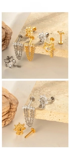 Detail of titanium bowknot chain labret studs with zircon stones in gold and silver
