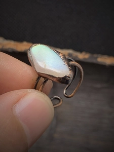 Close-up of vintage adjustable ring with irregular moonstone showing blue labradorescence