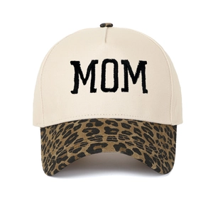 Detailed close-up of MOM embroidery and leopard print brim on this vintage trucker hat