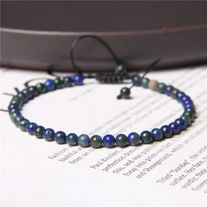Close-up of 4mm multi-color natural stone beads on black adjustable woven bracelet