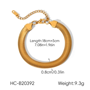 Detailed view of 18k gold plated snake chain bracelet with scale texture and lobster clasp