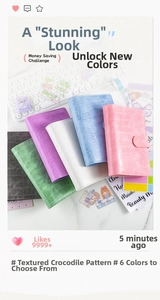 Close-up of A6 binders in six pastel colors featuring crocodile texture and metal buckles