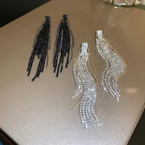 Exaggerated geometric fringe drop earrings with sparkling rhinestones in black and silver