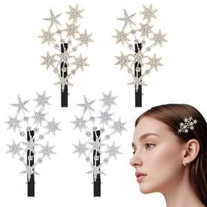 Close-up of sparkling star-shaped rhinestone hair clips in gold and silver set of four