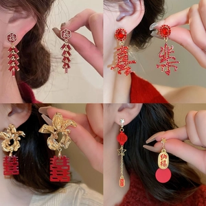 Festive red and gold Chinese New Year earrings with traditional lucky character designs