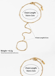 Detail view of gold PVD plated stainless steel hand chain with measurement labels