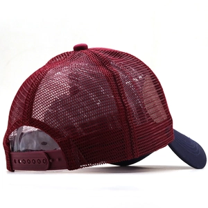 Burgundy mesh trucker hat with navy brim and adjustable snapback closure on plain background